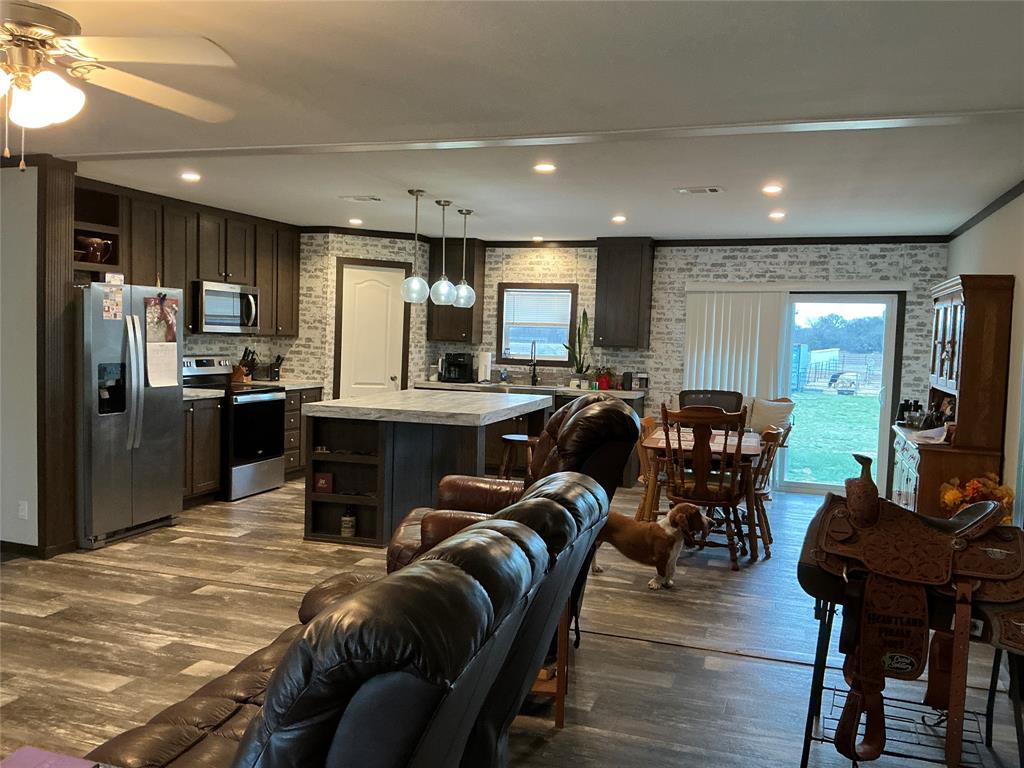 1595 Cr 131 Rising Star Tx 76471 Rising Star, TX 76471 - Photo 17 of 20 a living room with stainless steel appliances furniture a dining table and kitchen view