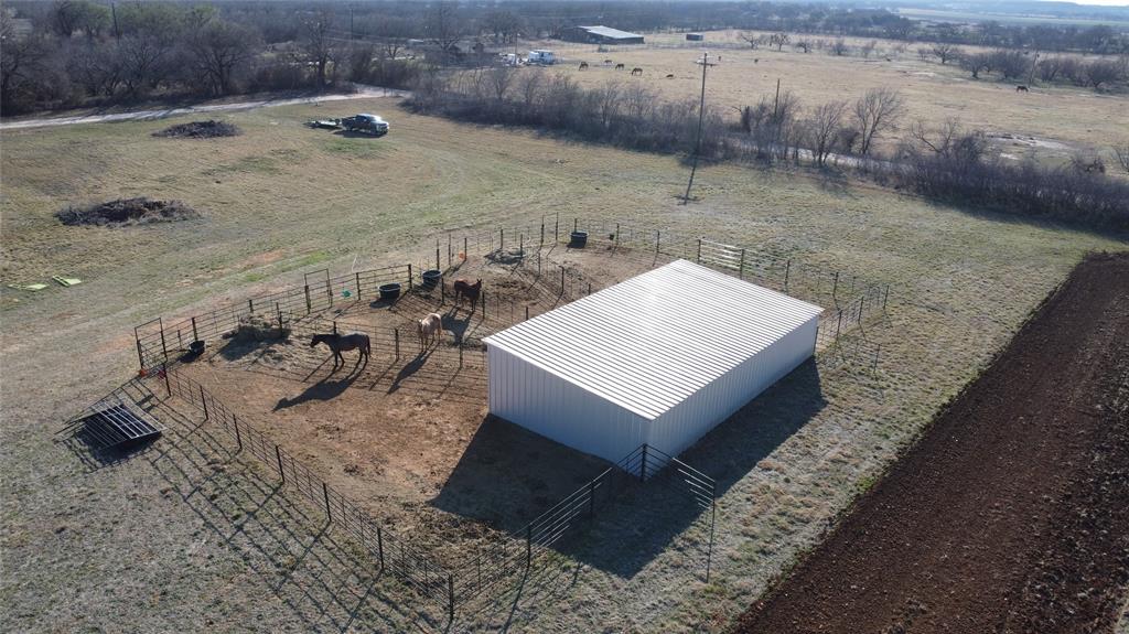 1595 Cr 131 Rising Star Tx 76471 Rising Star, TX 76471 - Photo 4 of 20 a view of a dry yard with wooden fence