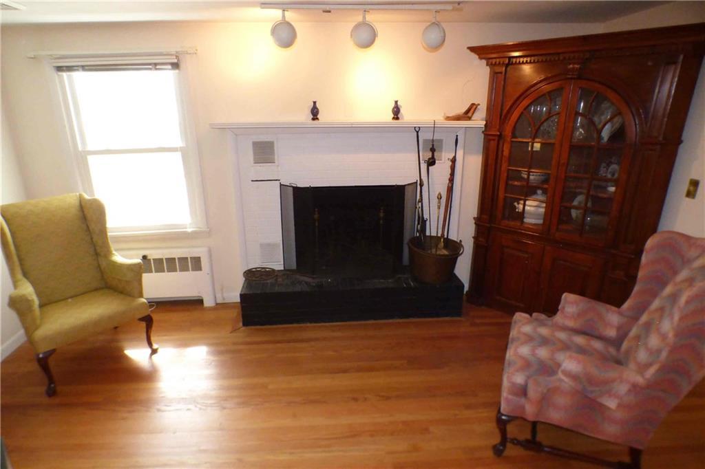 3 Simpson Lane York, ME 03909 - Photo 9 of 13 A fireplace and handsome wood floors...