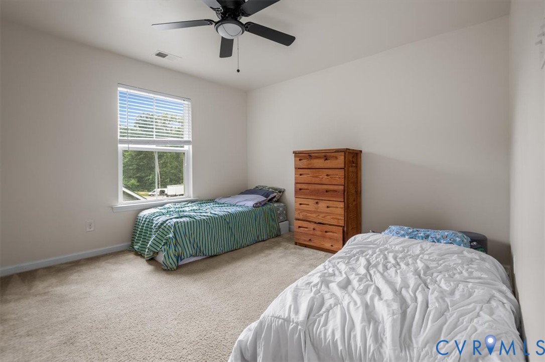 9013 Bailey Hill Road Midlothian, VA 23112 - Photo 38 of 56 Carpeted room featuring a ceiling fan, a window wi
