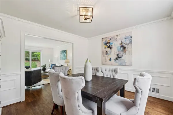 a view of a dining room with furniture window and wooden floor