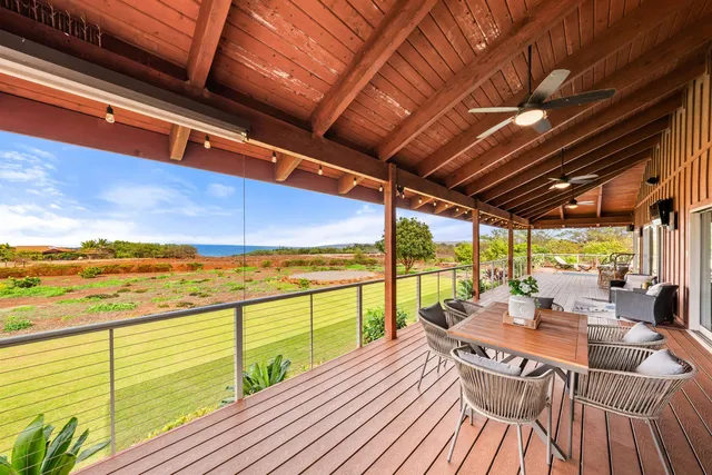 a view of a balcony with lake view and wooden floor