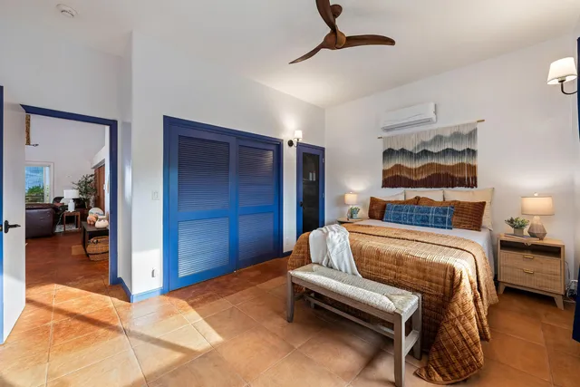 a bedroom with furniture and a chandelier