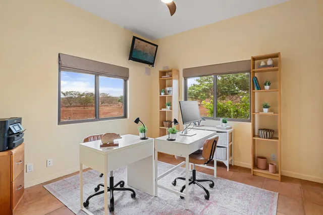 a workspace with furniture and a window