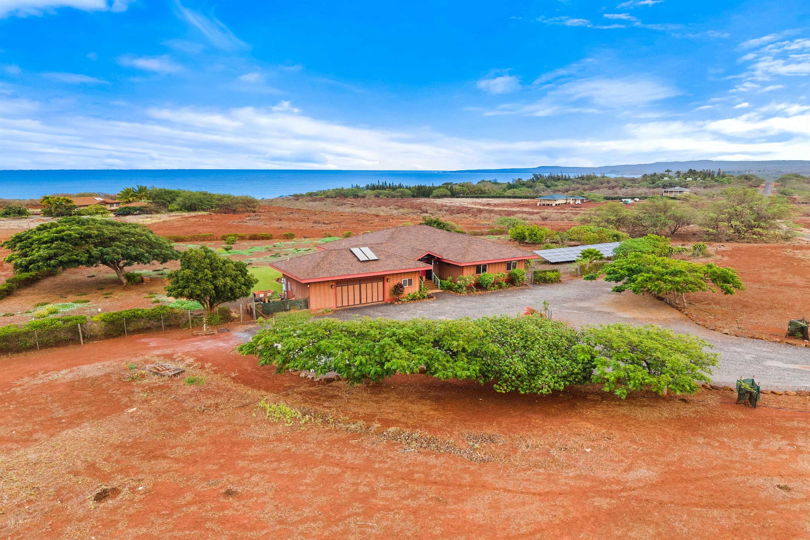 3820 Kalua Koi Road Maunaloa, HI 96770 - Photo 31 of 46 an aerial view of a city with lots of residential buildings in ocean