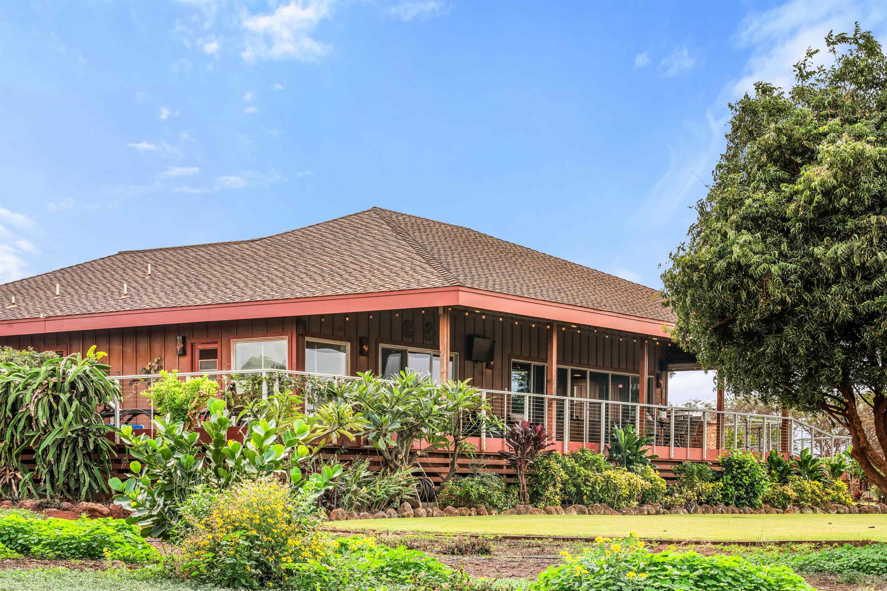 3820 Kalua Koi Road Maunaloa, HI 96770 - Photo 40 of 46 a front view of a house with a yard
