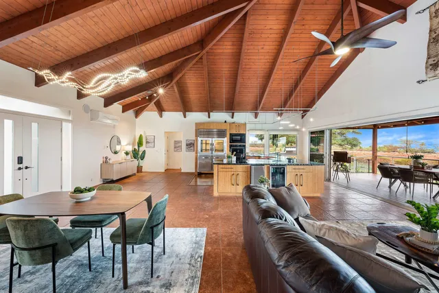 a living room with furniture and a table