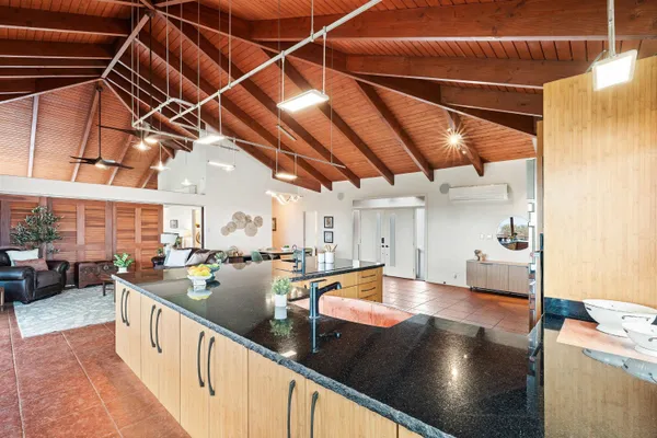 a view of a kitchen with a sink and a dishwasher