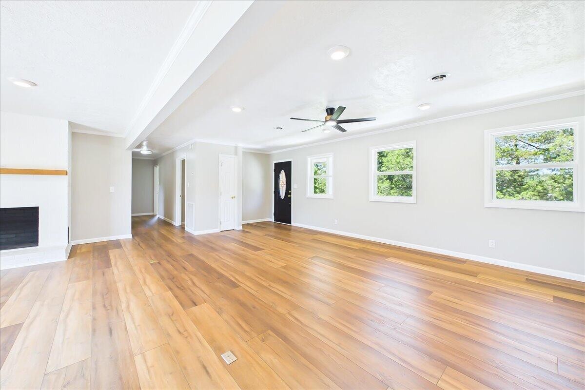 858 Main Street Decatur, TN 37322 - Photo 12 of 65 a view of empty room with wooden floor and fan