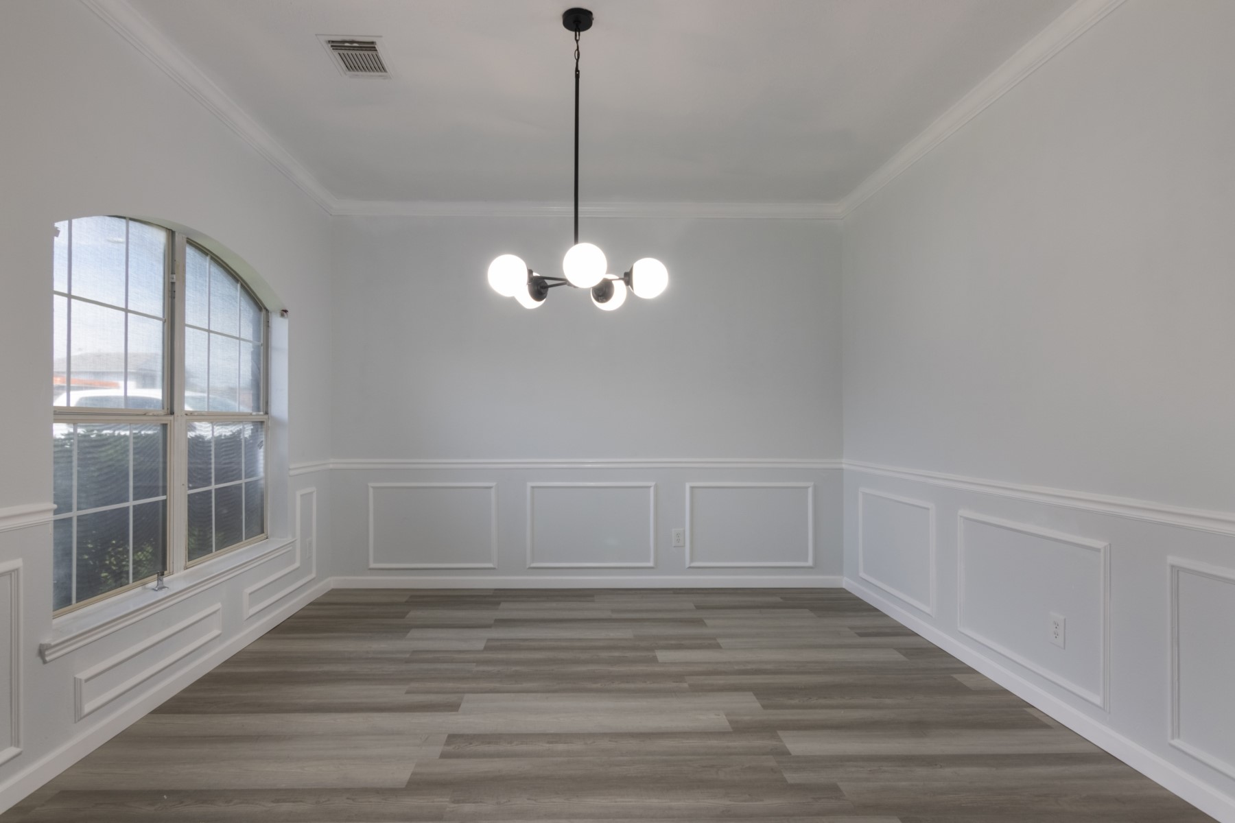 5326 Coast Line Street Baytown, TX 77521 - Photo 11 of 26 a view of a room with wooden floor and fan