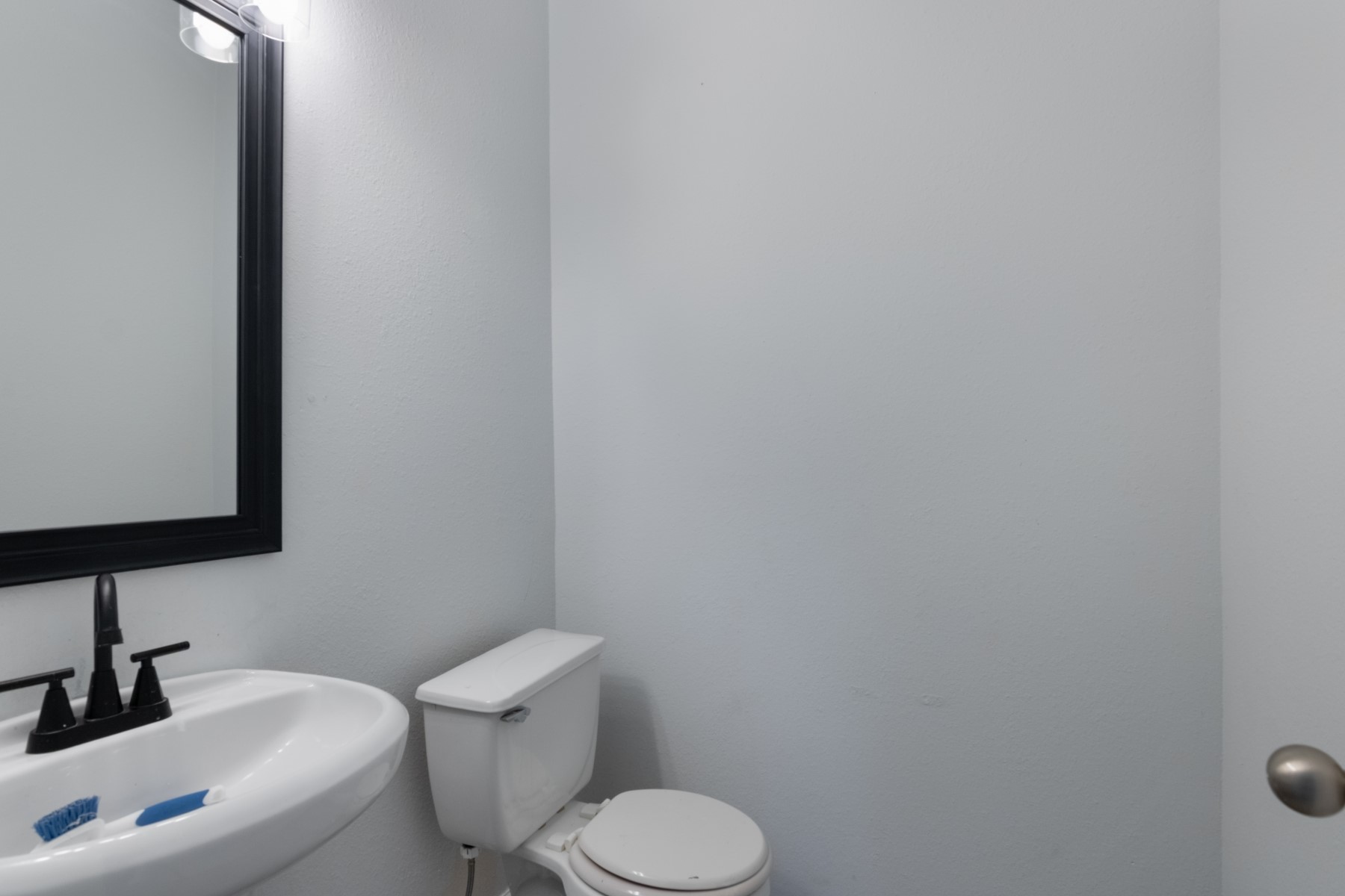 5326 Coast Line Street Baytown, TX 77521 - Photo 12 of 26 a bathroom with a toilet sink and mirror