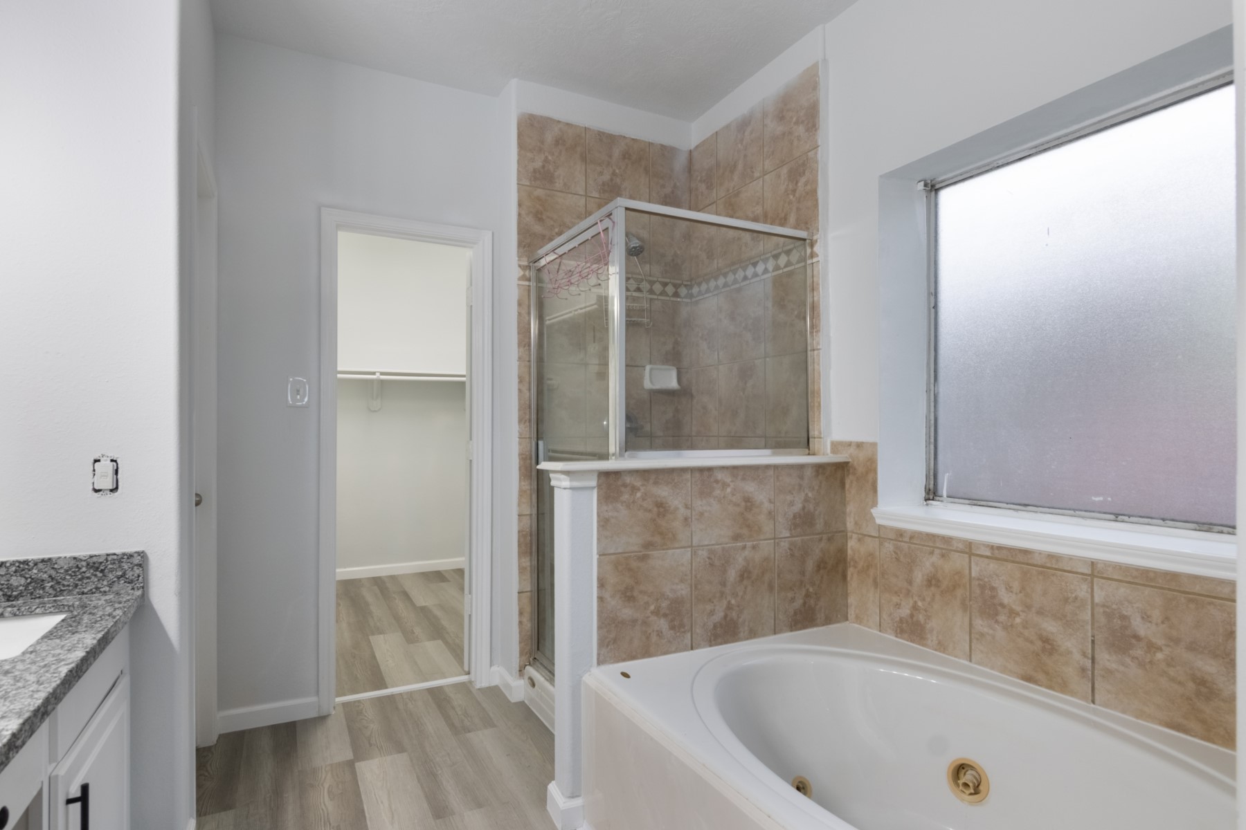 5326 Coast Line Street Baytown, TX 77521 - Photo 15 of 26 a bathroom with a tub and shower