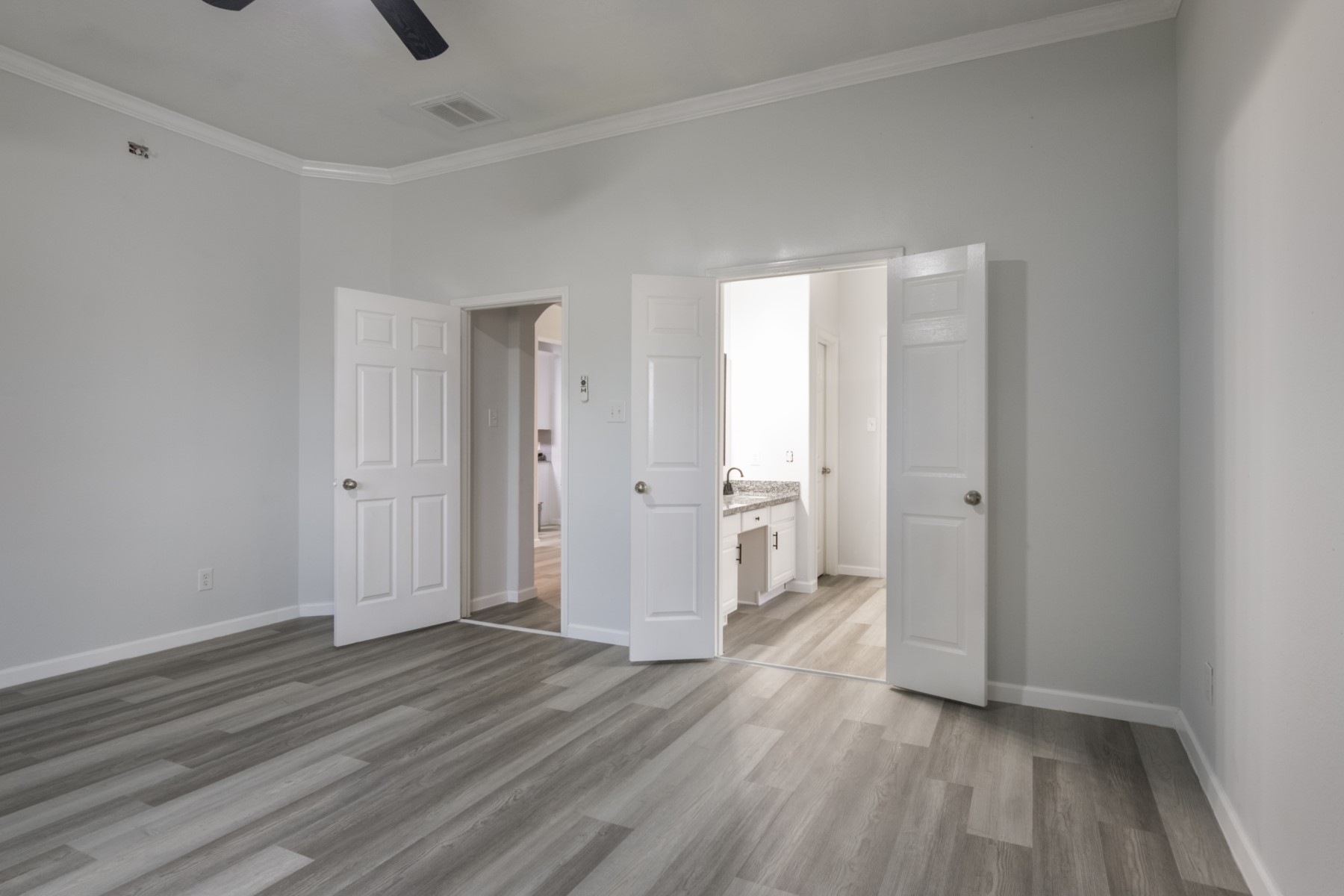 5326 Coast Line Street Baytown, TX 77521 - Photo 17 of 26 a view of a room with wooden floor and white walls