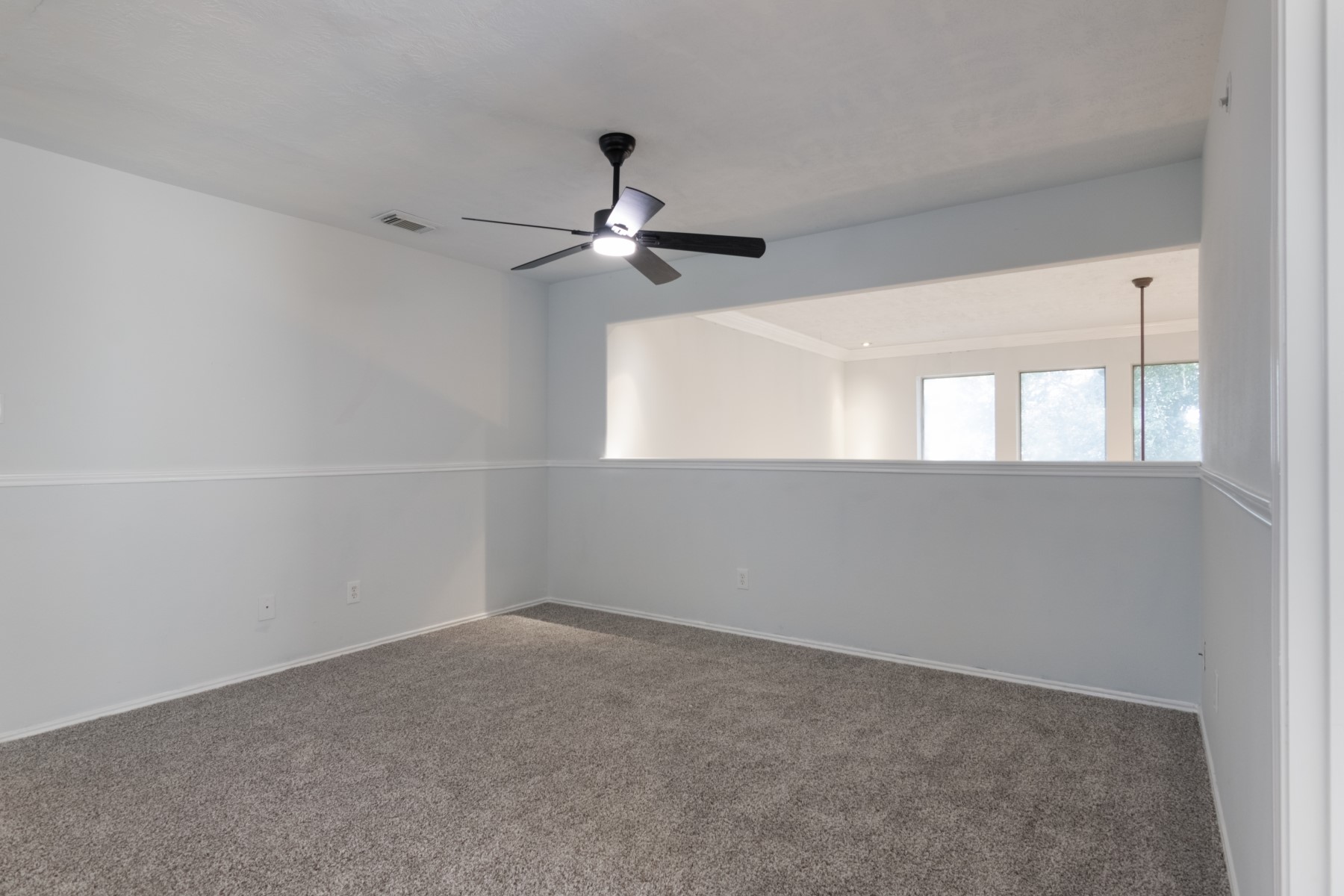 5326 Coast Line Street Baytown, TX 77521 - Photo 18 of 26 an empty room with a window and ceiling fan