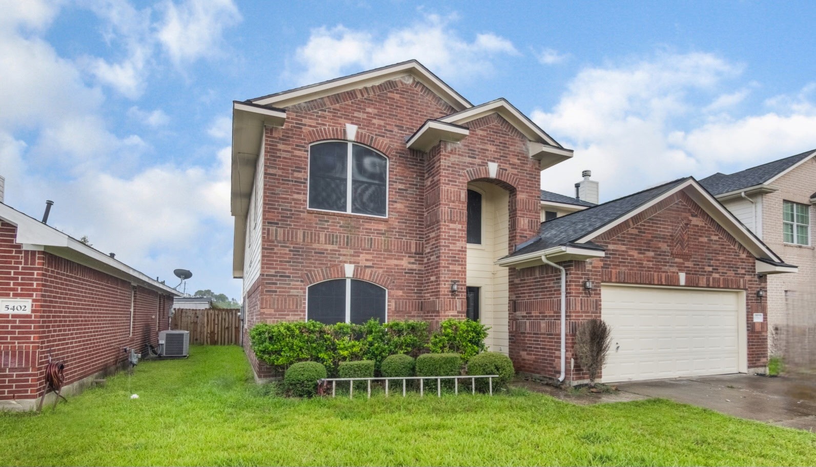 5326 Coast Line Street Baytown, TX 77521 - Photo 2 of 26 a front view of a house with a yard and garage
