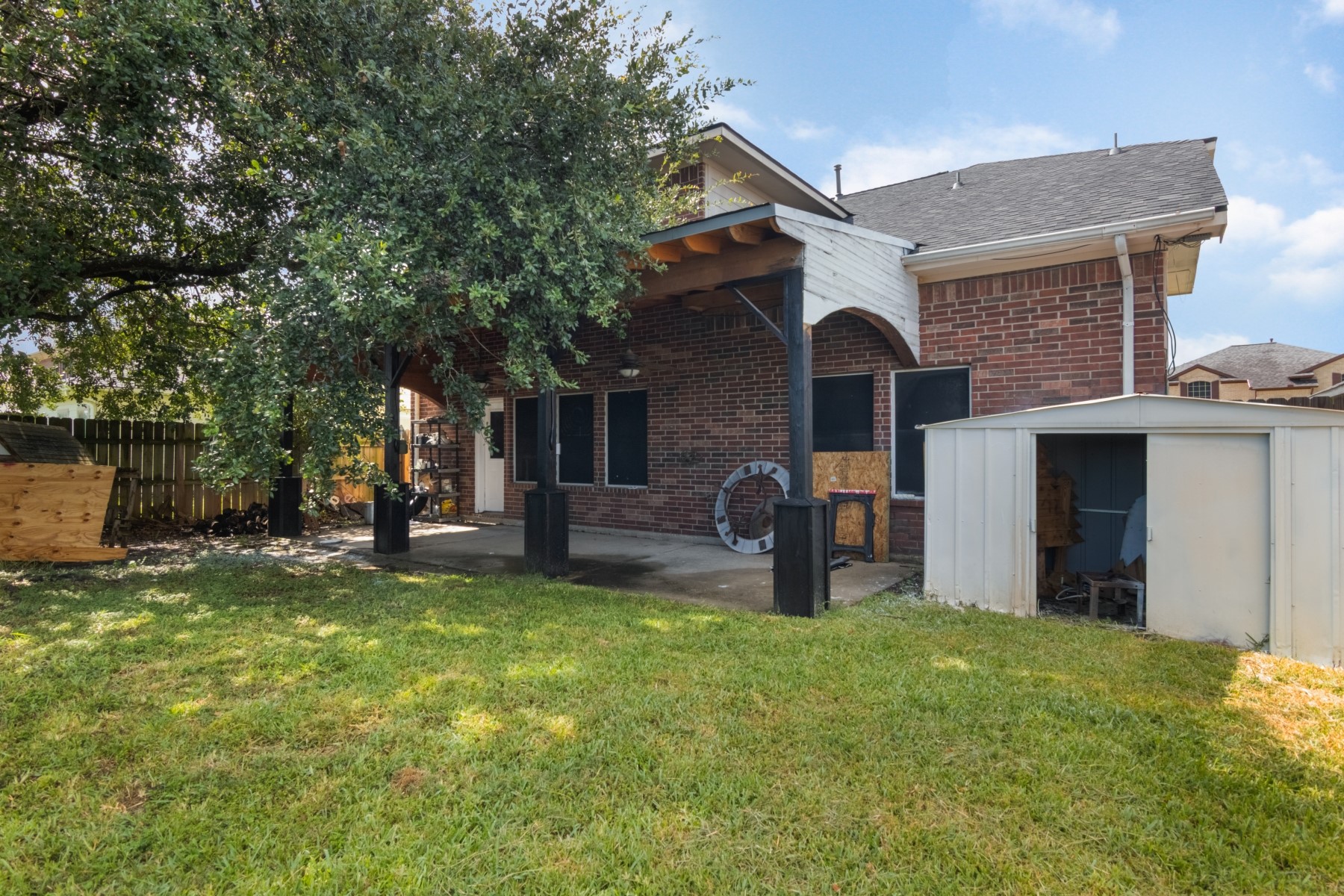 5326 Coast Line Street Baytown, TX 77521 - Photo 25 of 26 a front view of a house with a garden and trees