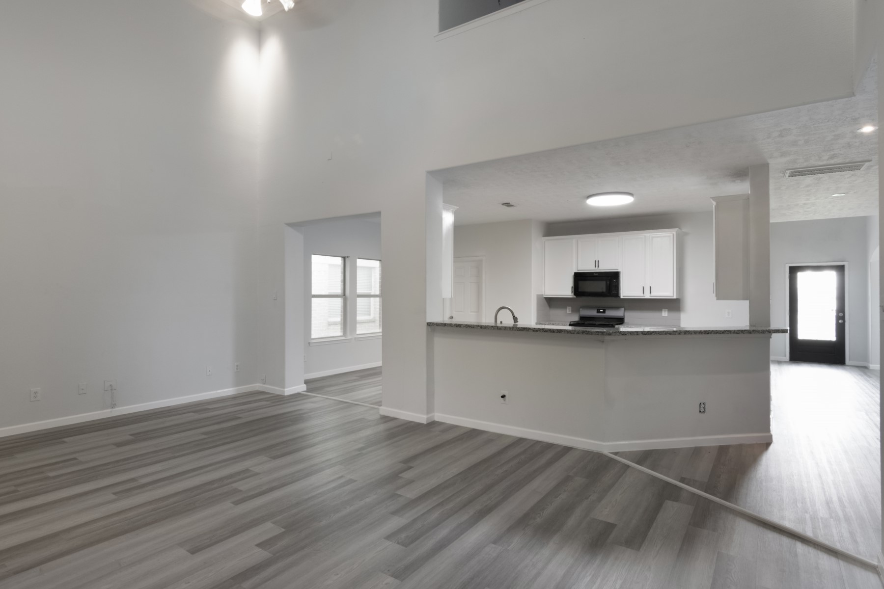 5326 Coast Line Street Baytown, TX 77521 - Photo 5 of 26 a view of kitchen with wooden floor and electronic appliances