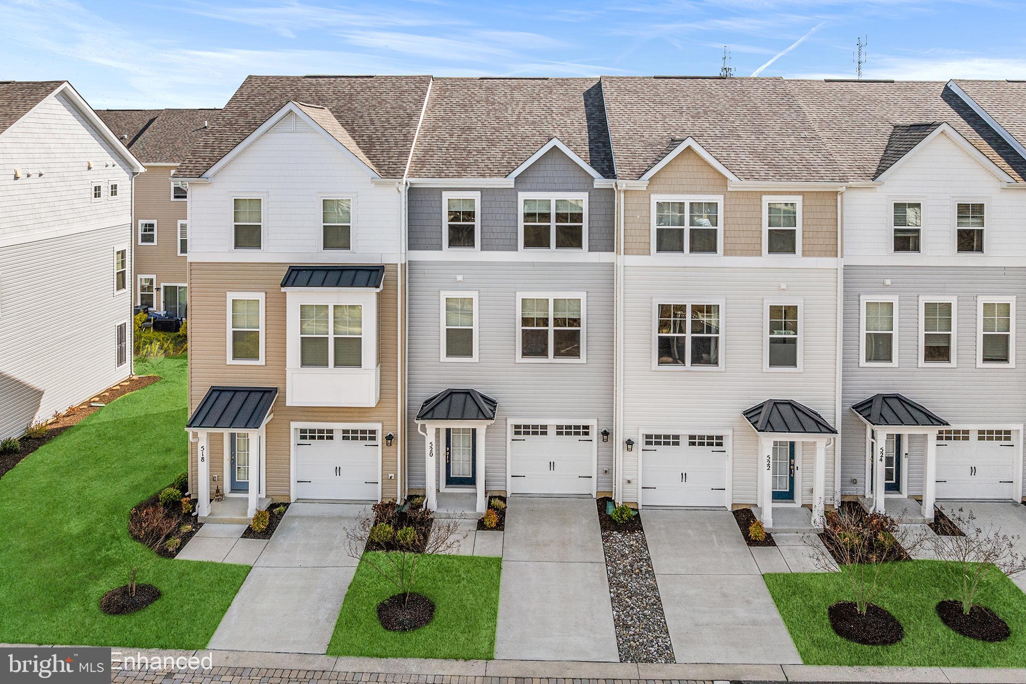 520 Marshy Cove, Unit 163 Cambridge, MD 21613 - Photo 1 of 42 a front view of a house with garden