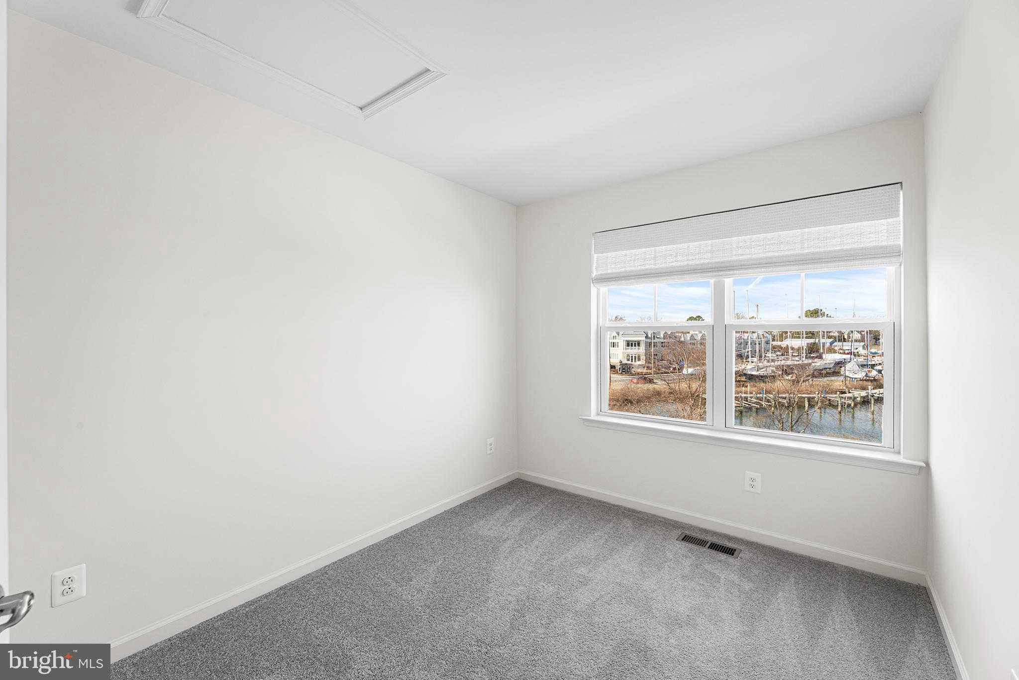 520 Marshy Cove, Unit 163 Cambridge, MD 21613 - Photo 28 of 42 an empty room with a window