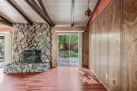 a kitchen with refrigerator and cabinets