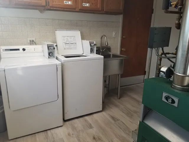 a view of a backyard with sitting area