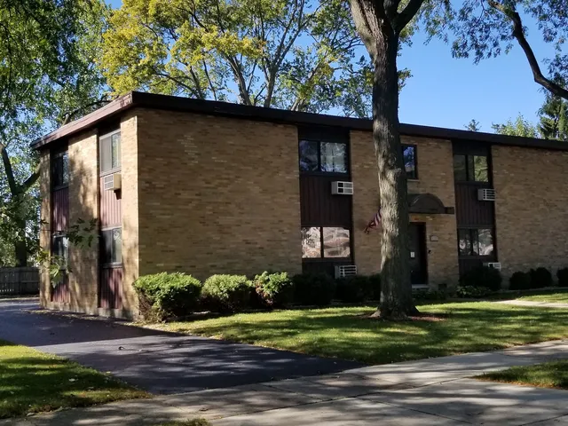a view of a house with a street