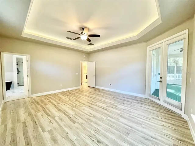a spacious bathroom with a double vanity sink mirror and double