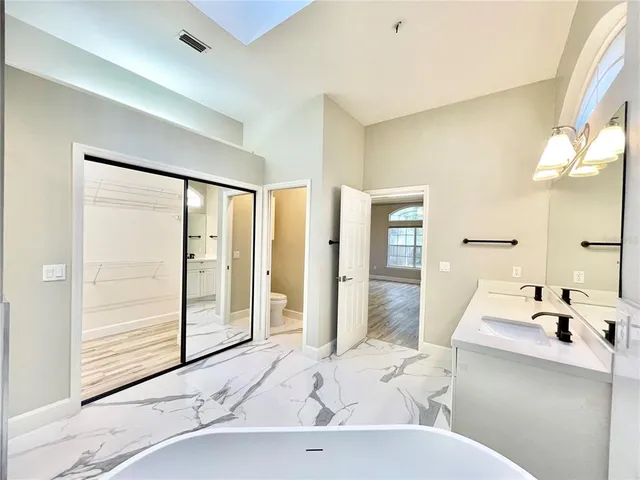 a view of an entryway with wooden floor