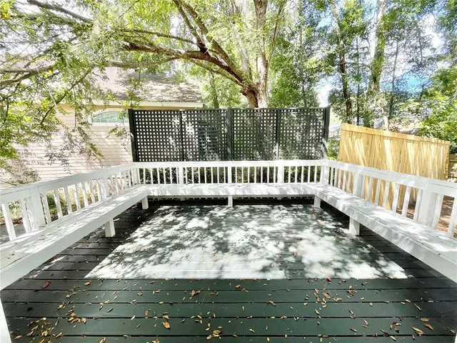 a view of bathroom with bathtub and wooden floor