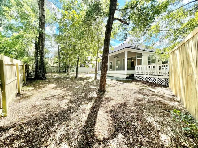 a view of a house and a yard
