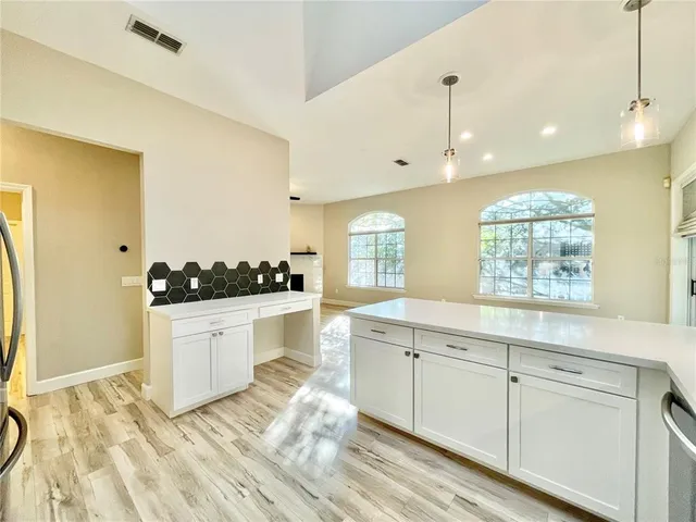 a view of cabinets with wooden floor