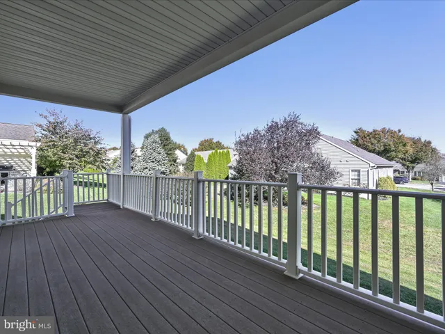 a view of a balcony with wooden floor