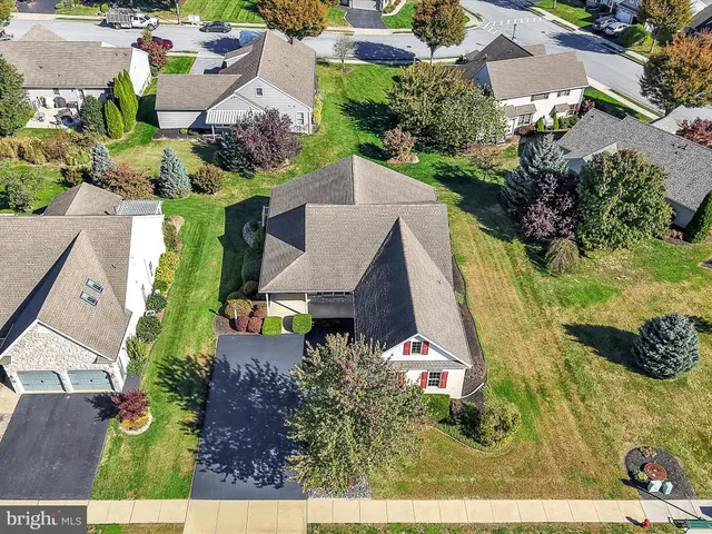 an aerial view of a house with a garden