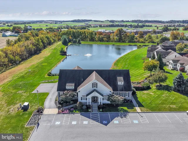 an aerial view of a house with a lake view