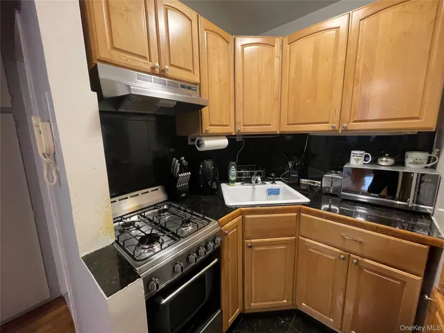 a kitchen with a stove and a microwave
