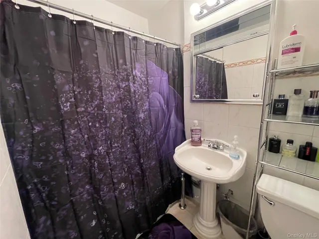 a bathroom with a sink toilet and vanity