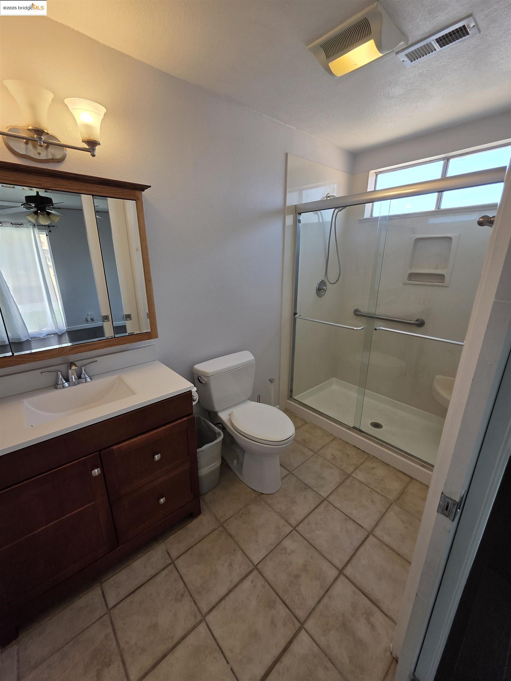 136 Evergreen Way Vallejo, CA 94591 - Photo 14 of 51 a bathroom with a sink a toilet and shower