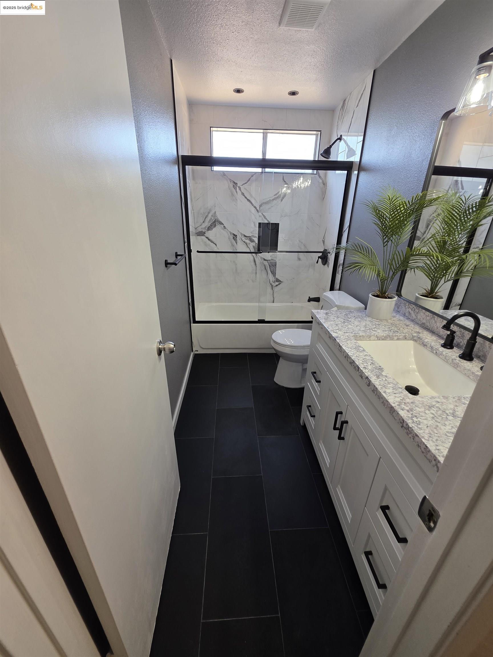 136 Evergreen Way Vallejo, CA 94591 - Photo 21 of 51 a bathroom with a sink mirror vanity and toilet