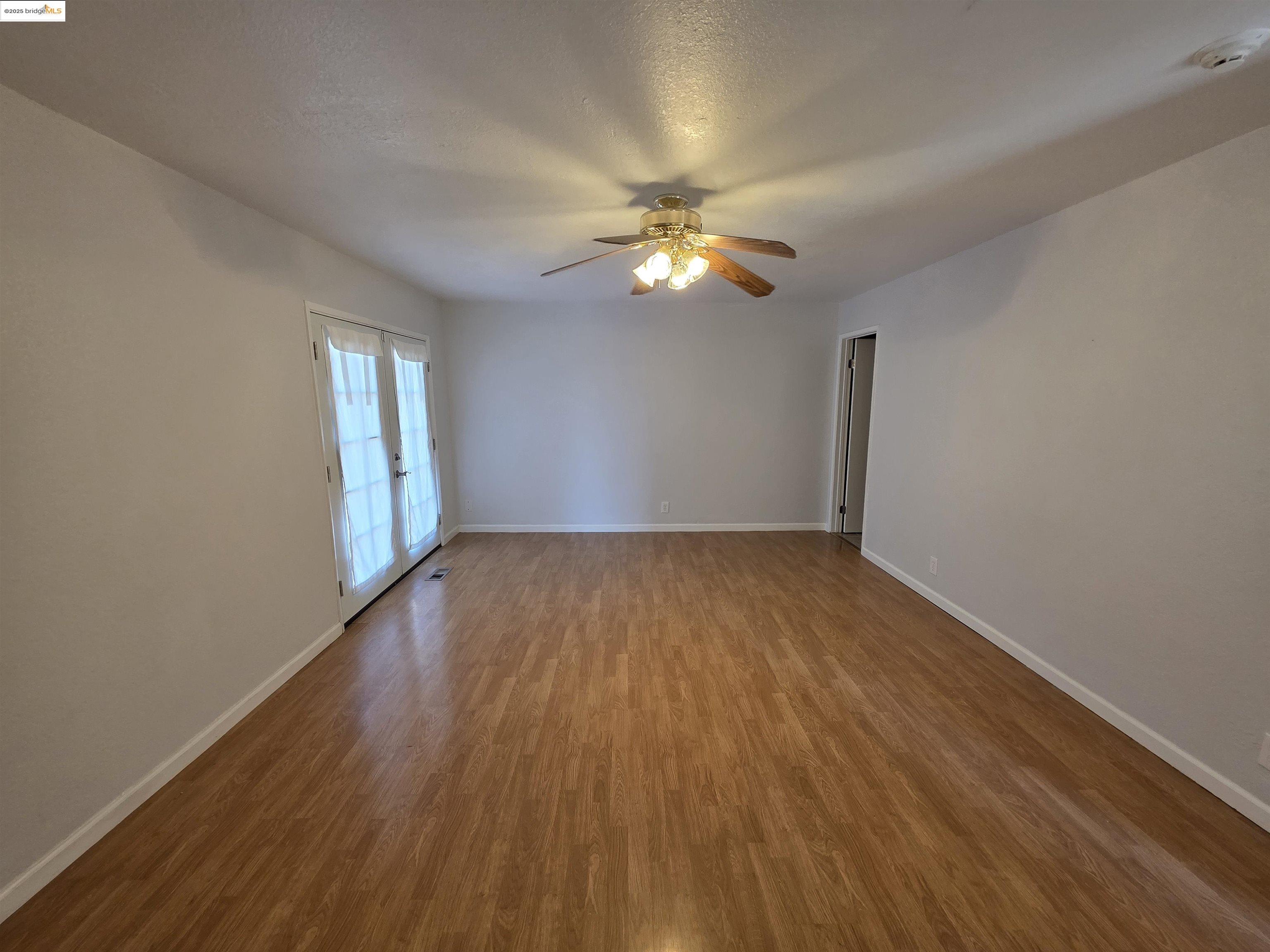 136 Evergreen Way Vallejo, CA 94591 - Photo 26 of 51 a view of empty room with wooden floor