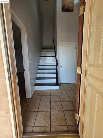 a bathroom with a toilet mirror and tub