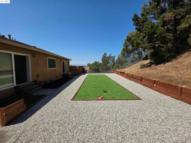 a backyard of a house with seating space