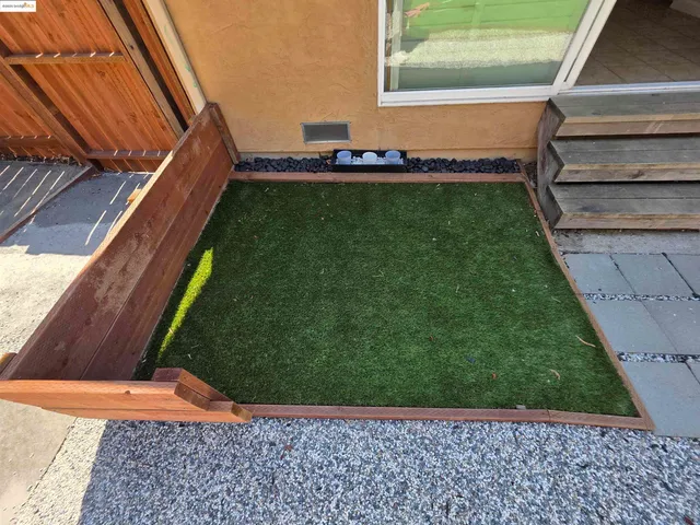 a view of a yard with an empty space