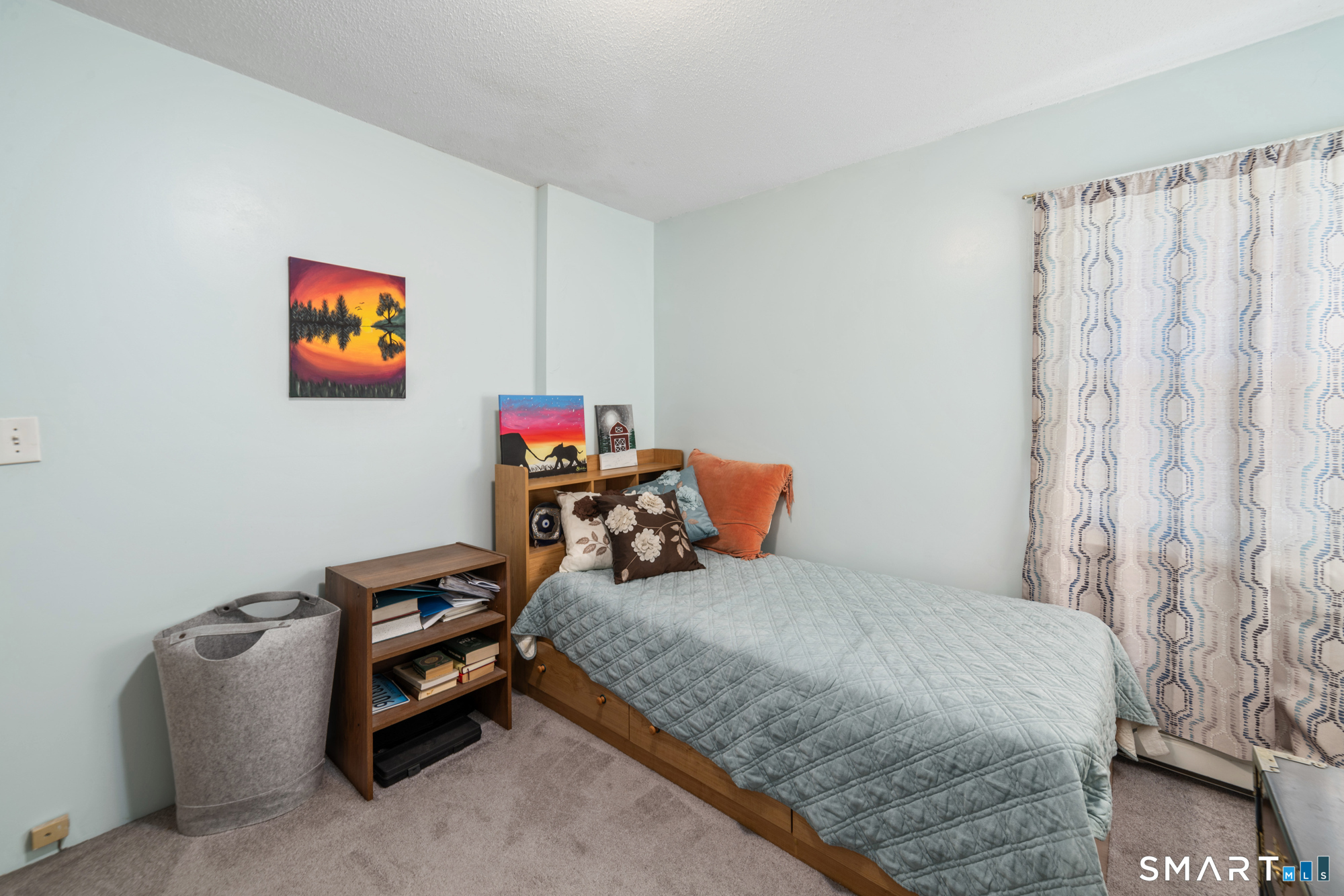 146 Highland Drive Waterbury, CT 06708 - Photo 14 of 31 a bedroom with bed and a book shelf