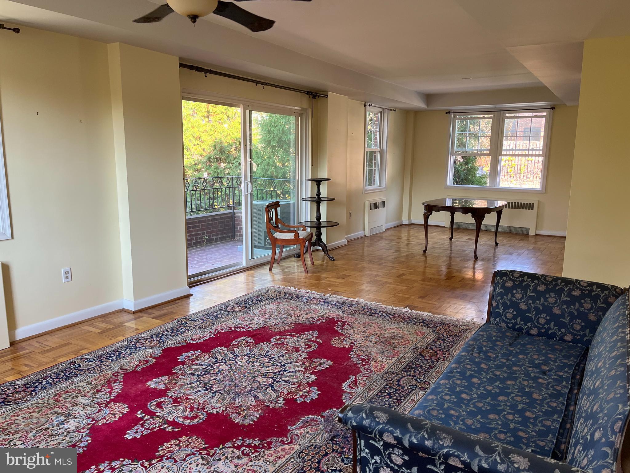 310 Ridgemede Road, Unit 207 Baltimore, MD 21210 - Photo 11 of 32 a living room with furniture and a window