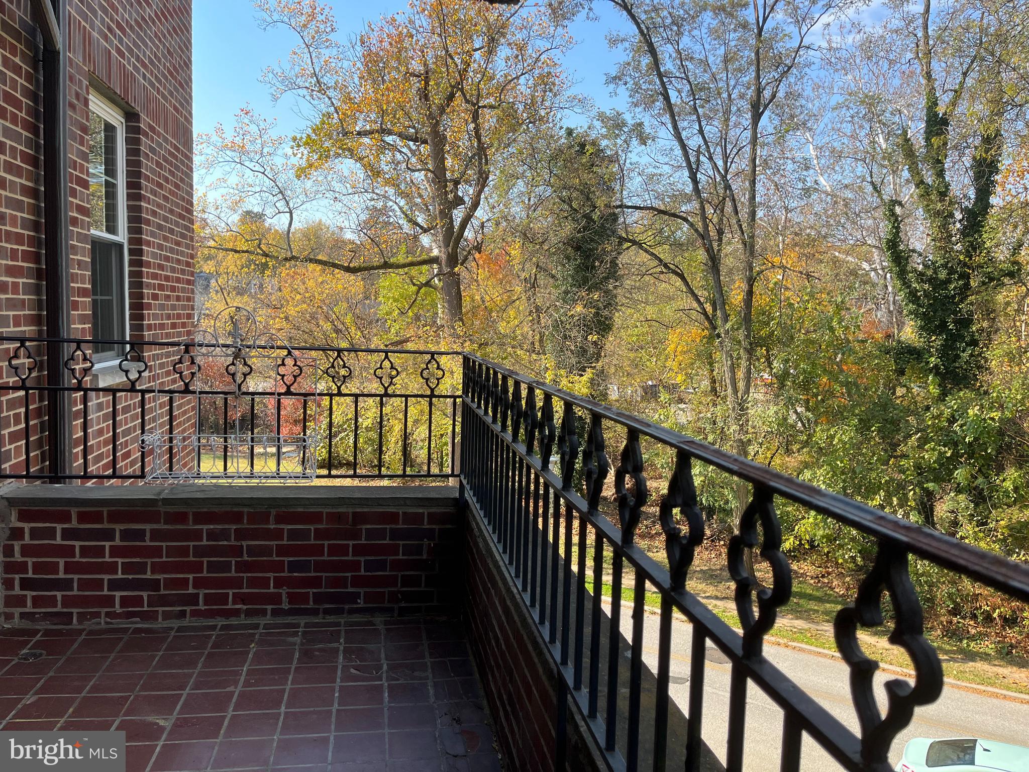 310 Ridgemede Road, Unit 207 Baltimore, MD 21210 - Photo 12 of 32 a view of a balcony with wooden fence and floor