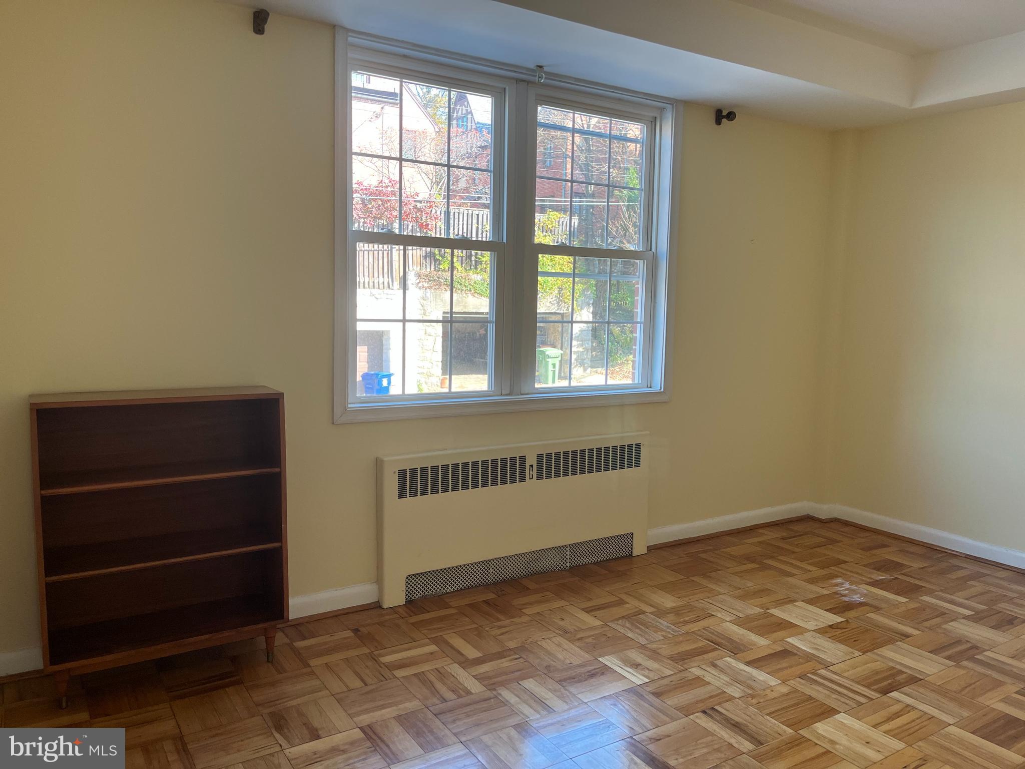 310 Ridgemede Road, Unit 207 Baltimore, MD 21210 - Photo 16 of 32 an empty room with windows
