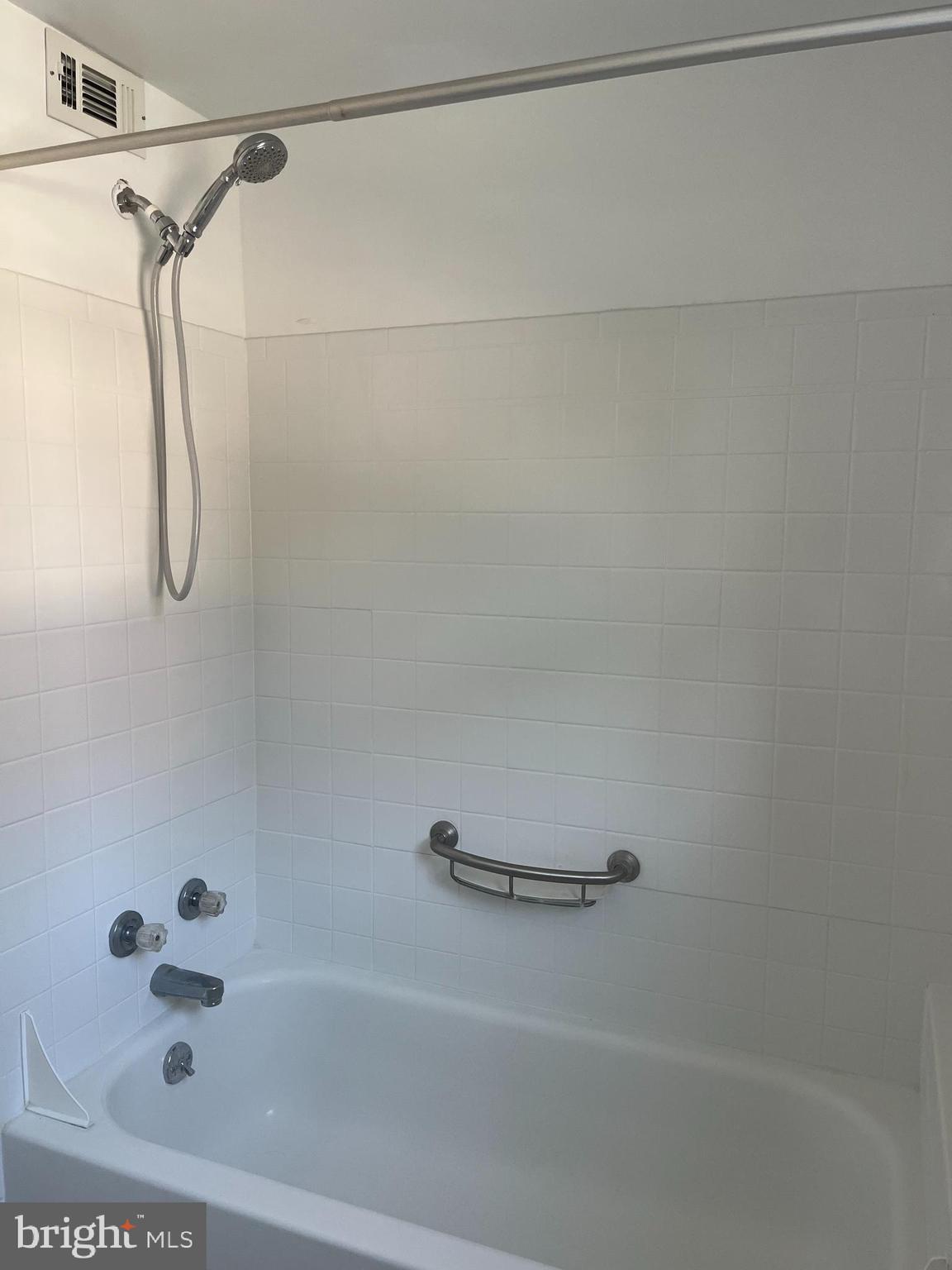 310 Ridgemede Road, Unit 207 Baltimore, MD 21210 - Photo 24 of 32 a bathroom with a shower