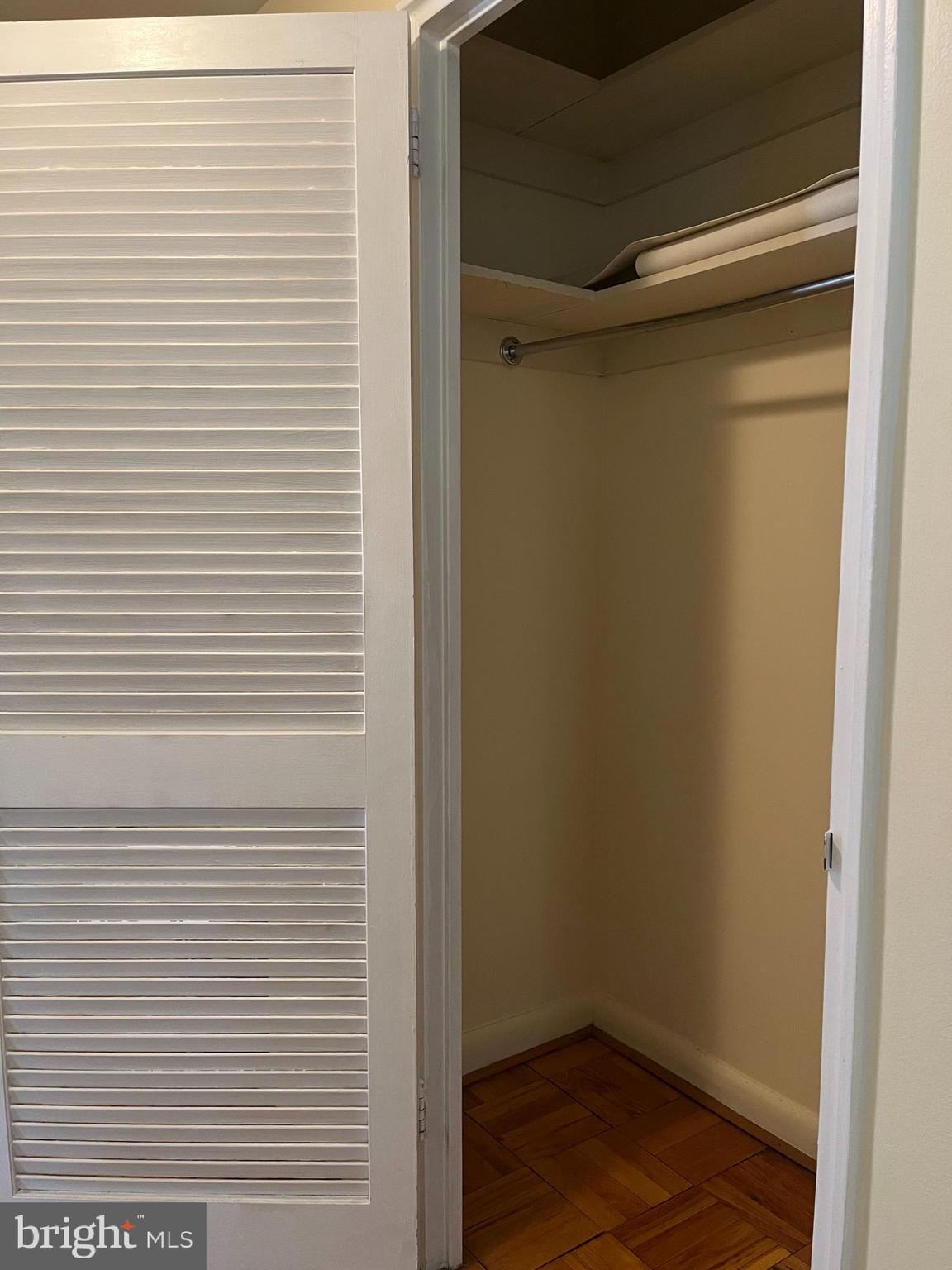 310 Ridgemede Road, Unit 207 Baltimore, MD 21210 - Photo 26 of 32 a view of a room with wooden floor