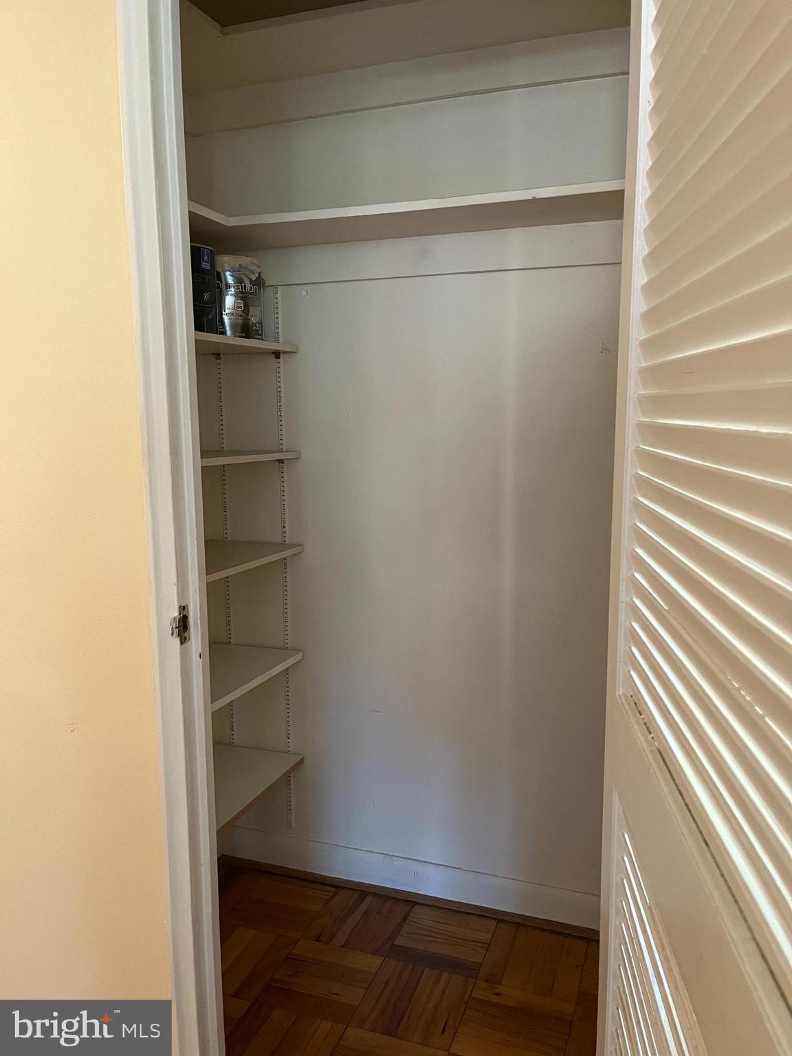310 Ridgemede Road, Unit 207 Baltimore, MD 21210 - Photo 27 of 32 a view of walk in closet with empty racks
