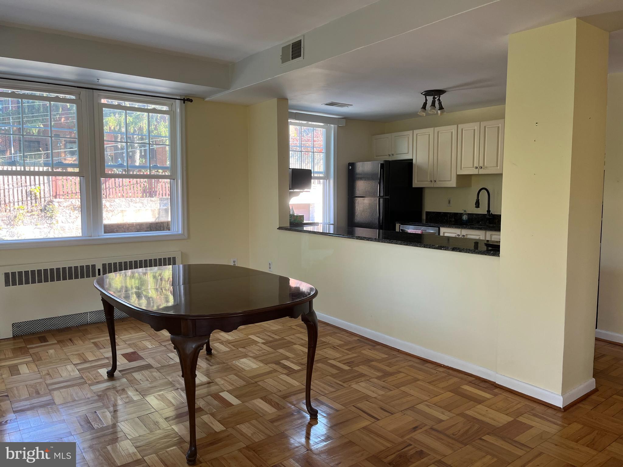 310 Ridgemede Road, Unit 207 Baltimore, MD 21210 - Photo 5 of 32 a room with furniture and a window